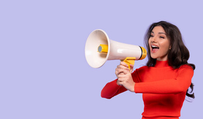 Engaging speaker expresses enthusiasm while using a megaphone against a light purple background