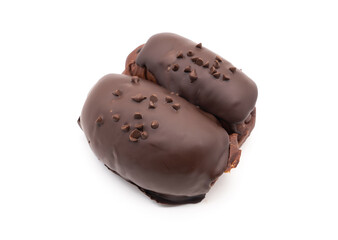 Dark Chocolate covered Bun with chocolate chips topping isolated on white background.