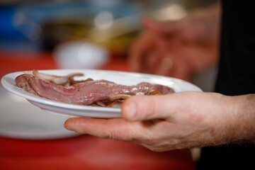 Chef is preparing piece of meat