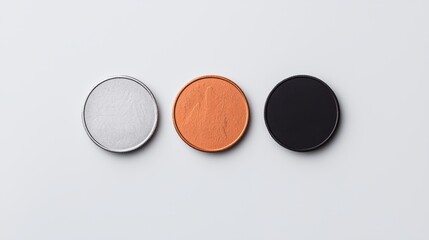 Three Round Colorful Coasters in Silver, Orange, and Black Tones