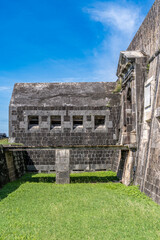 Panoramic view of caponier, citadel gate at Brimstone Hill Fort St Kitts and Nevis with cloudy blue...