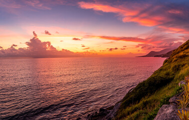 Stunning Caribbean sunset with orange, pink, purple sky in St Kitts and Nevis