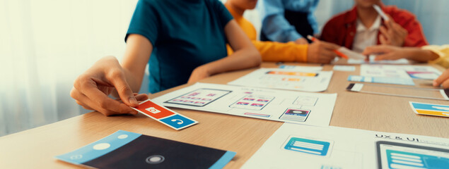 Panorama banner of startup company employee planning on user interface prototype for mobile application or website in office. UX UI designer brainstorm user friendly interface plan. Synergic