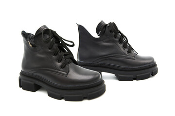 Fashionable leather lace-up boots isolated on white background. View from all sides.	