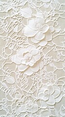 Elegant white floral lace fabric with intricate patterns and flower designs, perfect for vintage or formal settings.