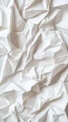Obraz premium Close-up of crumpled white paper creating a textured, abstract background.