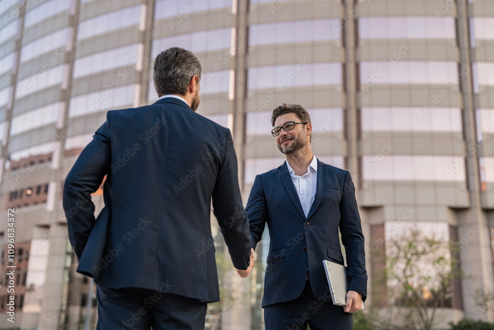 Wall mural Celebrate business partnership. Two businessmen partner celebrating business deal. Successful partnership in business deal. Businessmen dealing outdoor. Partnership success. Cooperation.