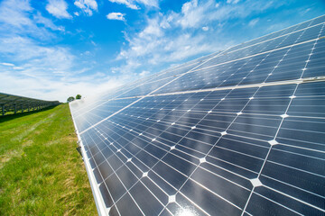 Solar power capturing station and storage plant. Solar panels farm wide geometric view. Renewable eco-friendly energy and green technology reducing carbon footprint and environmental impact.