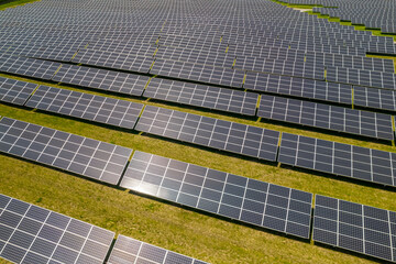Solar power cells panels at power station in the field aerial. Green energy and ecology innovation for preservation of nature and avoid environment impact. Photovoltaic solar panels technologies