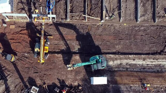 Heavy machinery operates on construction site for new development in rural area