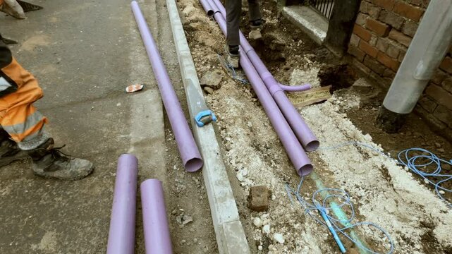 New telecom ducts for internet broadband cable installed along the city sidewalk for improved infrastructure upgrades