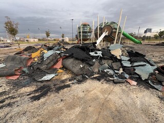 Rubber trash pile. The rubber pavement of the park has rotted, deteriorated. Rubber tiles in the...