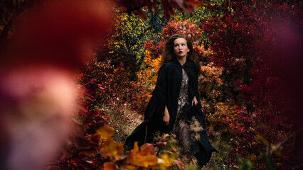 Young fairy tale woman running. A scared girl princess in a long green cloak is haunted by witch...
