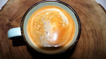 Cup of coffee on the wood background . High quality photo