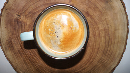 Cup of coffee on the wood background . High quality photo