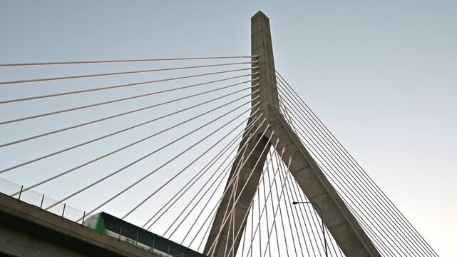 The iconic architecture of Boston in Massachusetts, USA showcasing the Zakim bridge against the blue sky on a sunny morning.