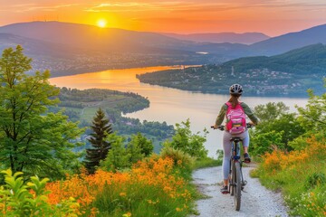 Fototapeta premium Biking adventure at sunset overlooking river valley nature scene outdoor environment scenic viewpoint adventure concept