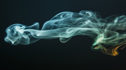 Fototapeta premium A wisp of green smoke against a black background, taken with a wide-angle lens.