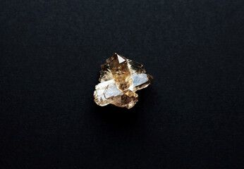 Smoky quartz crystals on dark background. Semi-precious natural stones rauchtopaz for magic and...