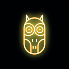 Yellow neon sign of an owl glowing on a black background