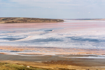 Koyashsky salt lake, pink and blue background. Nature.