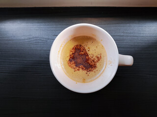 A cup of cappuccino or coffee in the morning with the light. Daily life, copy space, people's activities