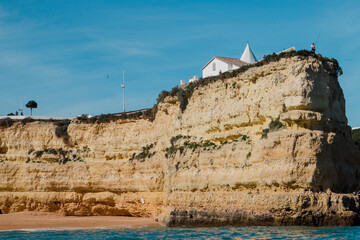 An area within Algarve, on a cliff that look out into the sea, with the 16th century Chapel of Praia de Nossa Senhora da Rocha, Senhora da Rocha beach on one side and Praia Nova on the other. 