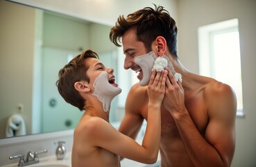 Happy father and son shave together in bathroom. Boy imitates dad applying shaving foam. Family fun morning routine. Home lifestyle image. Child and parent bond.