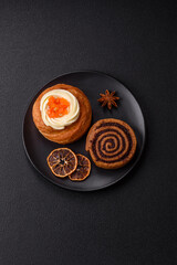 Sweet dessert danish covered with white cream and citrus, with cream filling