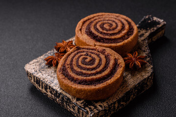 Freshly baked cinnamon roll with spices and cocoa filling