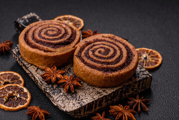 Freshly baked cinnamon roll with spices and cocoa filling