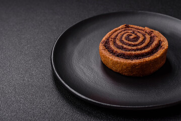 Freshly baked cinnamon roll with spices and cocoa filling