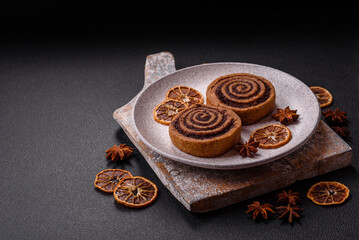 Freshly baked cinnamon roll with spices and cocoa filling