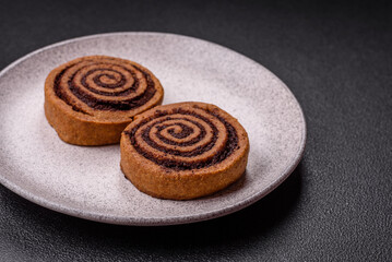 Freshly baked cinnamon roll with spices and cocoa filling