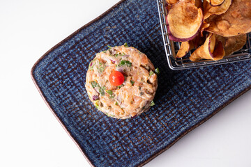 smoked salmon tartare with biquinho pepper and healthy starter in the restaurant white background top view