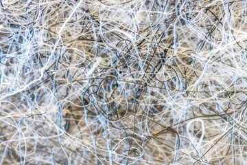 Ultra macro of a piece of grey felt with indvidual tangled  fibres, abstract