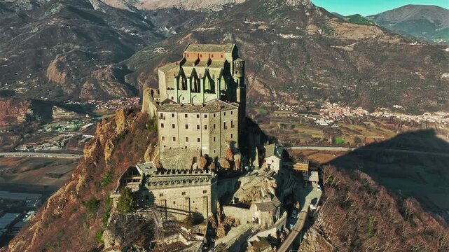 Aerial view of the Sacra di San Michele, an imposing abbey that dominates the entrance to the Susa Valley from the top of Mount Pirchiriano. Italy