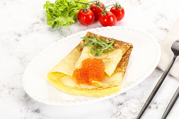 Russian pancake with red caviar