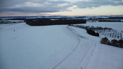 Obraz premium winter landscape with snow and clouds, czech,Hnevosice, silesia region, morning view, drone 