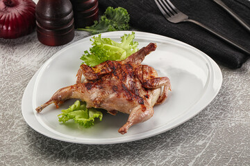 Grilled quail in the plate