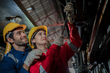 Engineer checking construction process railway and checking work on railroad station . Railway engineer checking machines in train station. Train engineer concept