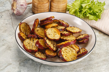 Baked red batat slices with herbs