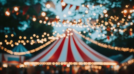 Colorful circus tent illuminated at night with festive lights and decorations in a lively outdoor setting