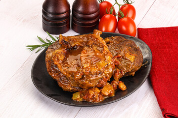 Italian cuisine - ossobuco with sauce