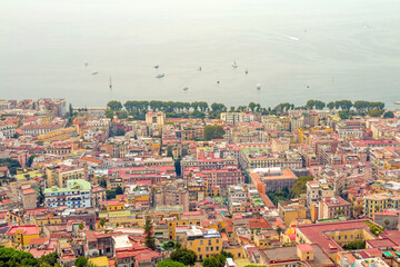 Obraz premium Captured from Sant'Elmo Castle, this photo reveals Naples’ vast cityscape, historic architecture, and iconic Mount Vesuvius framed by the Italian sky
