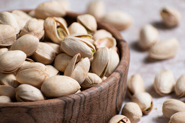 Pistacia vera, Pistachios nuts, peeled pistachio nuts close-up on the table, healthy food, Tasty roasted pistachios,crunchy snack for healthy eating.