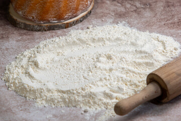 Baking time of the cake, spilled flour and ready cake, rolling pin with spilled flour, Photo Food, flour with rolling pin