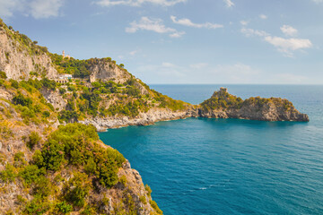 Fototapeta premium The photo of the stunning Amalfi Coast from a cruise ship deck, showcasing cliffs, charming villages, and lush landscapes against the turquoise sea and vibrant blue sky. Positano, Amalfi, Atrani