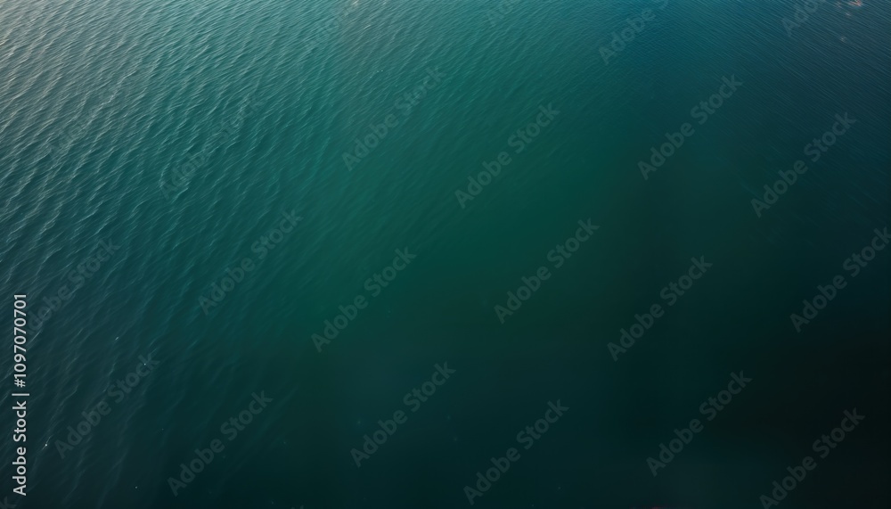 Poster Overhead lake view shows deep blue water surface. Ripples create texture pattern. Natural liquid background ideal for summer themes. Water pool image perfect for website wallpaper. Clear deep blue