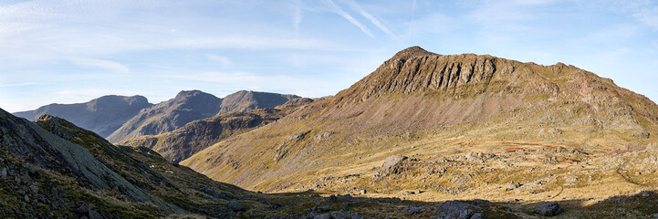 Panorama of the summits of Scafell Pike and Bowfell seen on the descent of Crinkle Crags, Lake District, UK